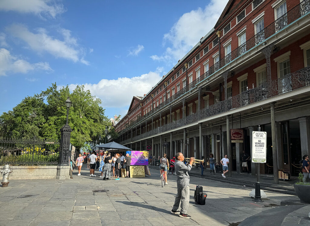 Jackson Square with a guy blowing trumpet