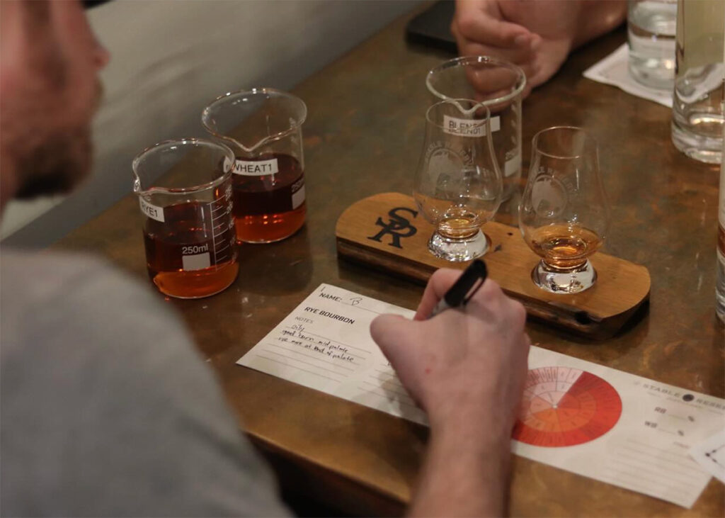 Blending bourbon at Stable Reserve Distillery